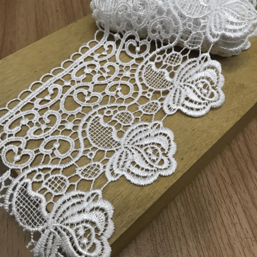 Delicate chemical lace fabrics produced by Mehran Enterprise, featuring fine patterns ideal for bridal wear, formal dresses, and high-end textiles.