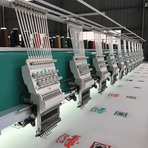 Multi-head embroidery machine at Mehran Enterprise used for creating detailed embroidered laces for fashion, bridal, and textile applications.