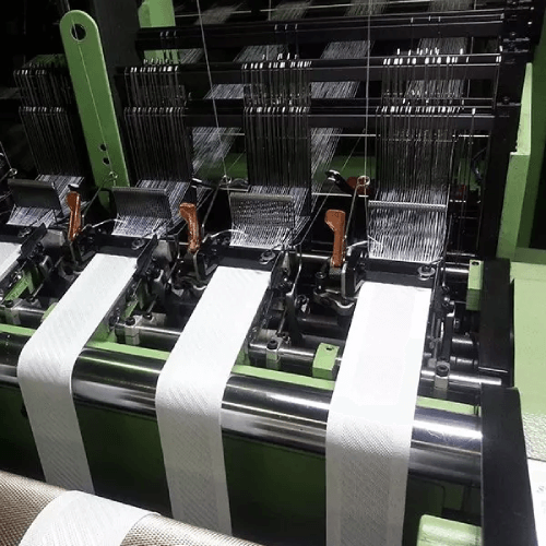 edle loom machine used to produce elastic laces for garments, waistbands, and stretch fabrics.