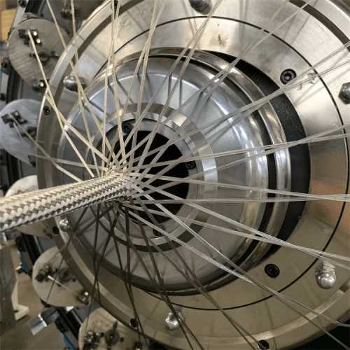 Industrial braiding machine used by Mehran Enterprise to produce strong, uniform braided laces for garments, crafts, and textile applications.