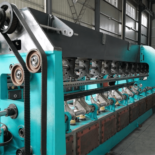 Raschel knitting machine used by Mehran Enterprise for producing lightweight, patterned lace fabrics in large-scale textile manufacturing.